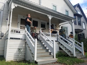 Band playing music on a porch