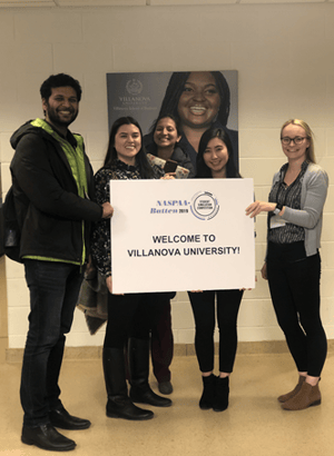 Students holding a sign that says Welcome to Villanova University